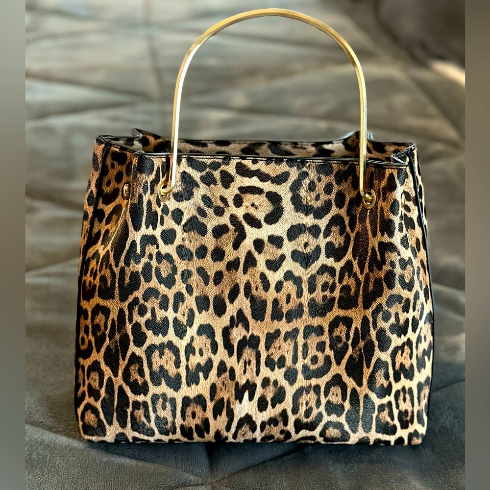 Leopard print satchel purse with gold hardware. Lightweight and spacious.